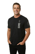 Man wearing a black t-shirt with text and graphics against a gray background