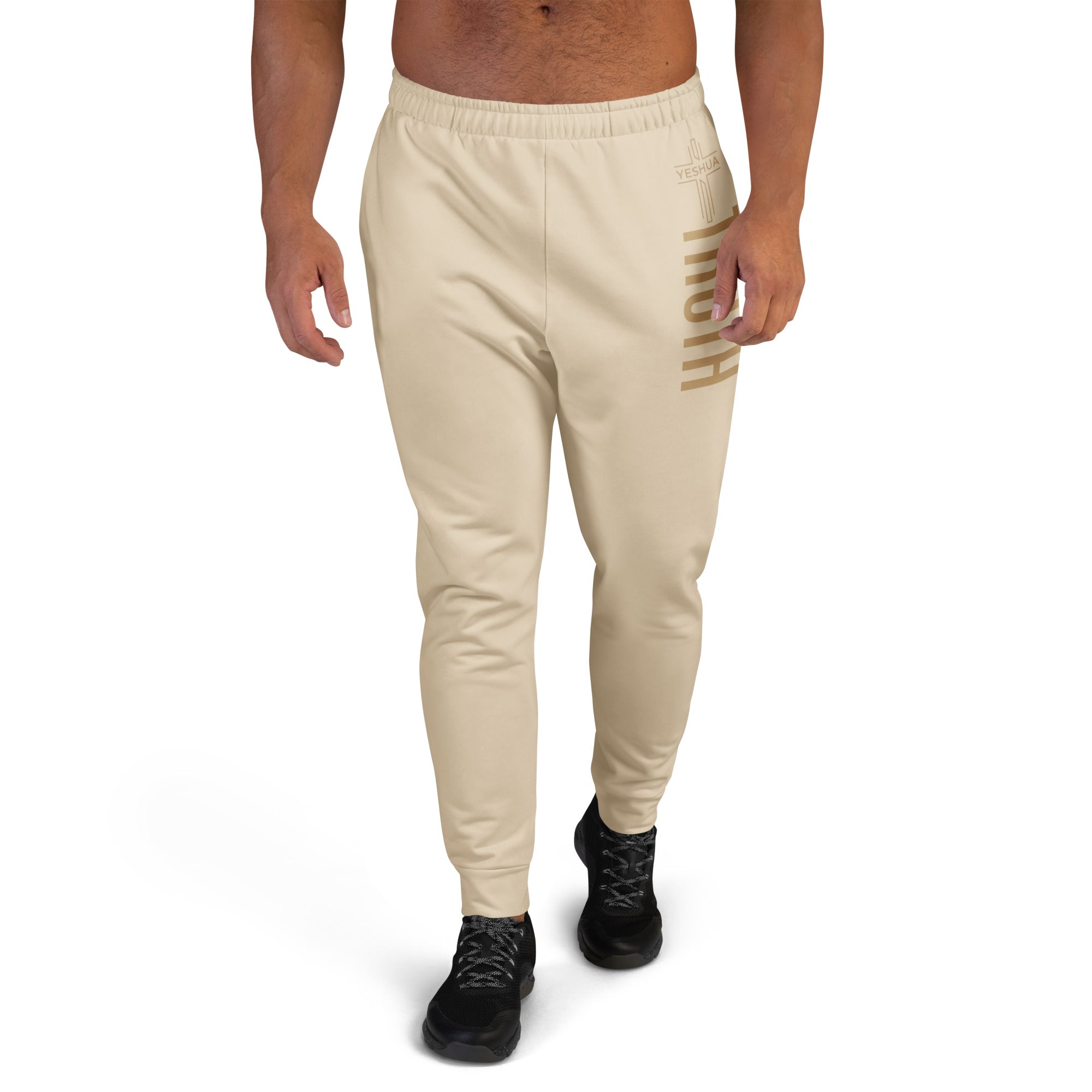 Beige jogger pants with text on a white background