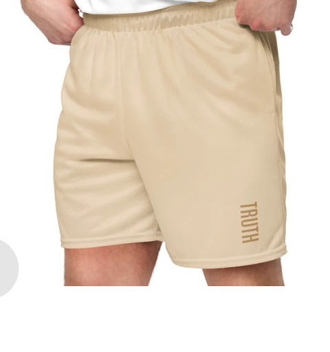 Beige shorts with 'TRUTH' branding on a white background