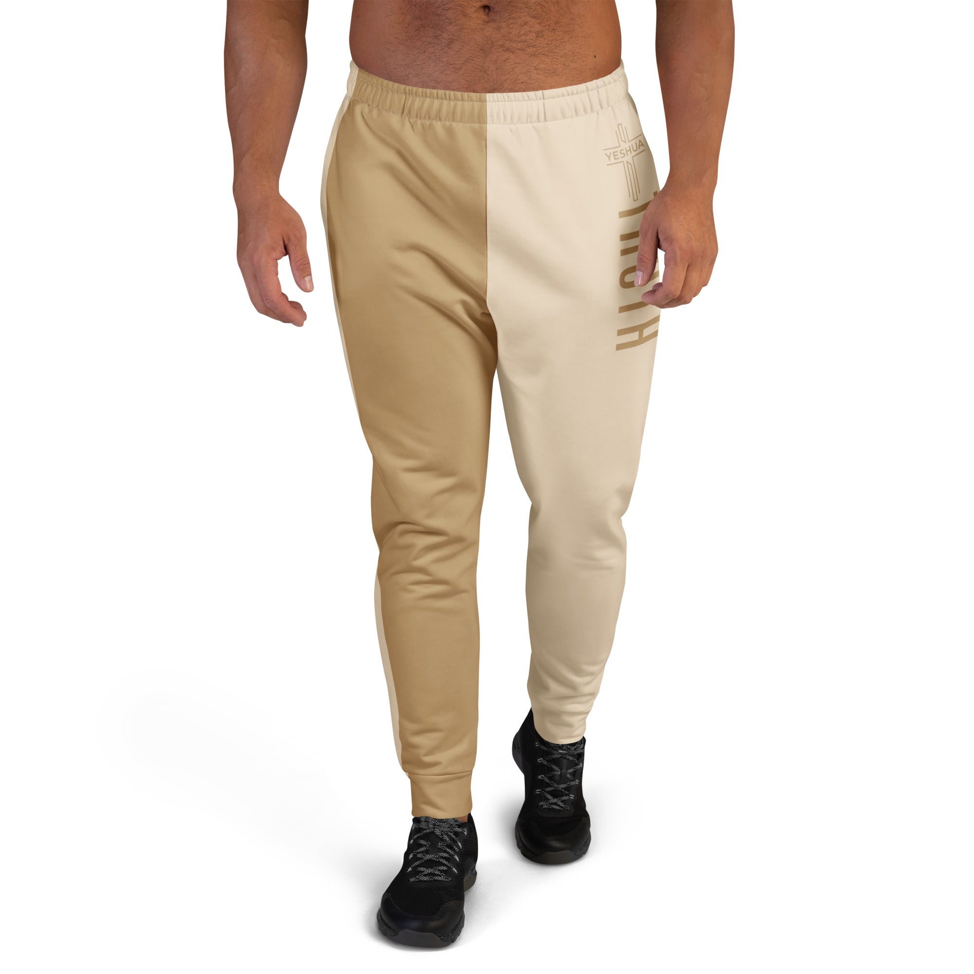 Beige jogger pants worn by a person on a white background