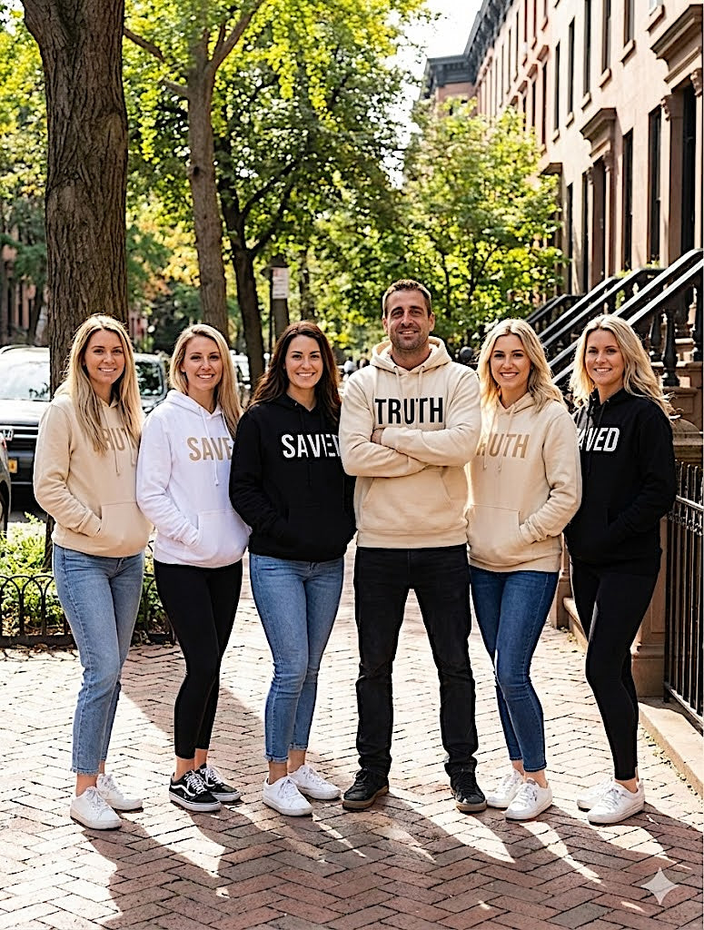 Group of six people wearing 'SAVE TRUTH' hoodies on a city street.